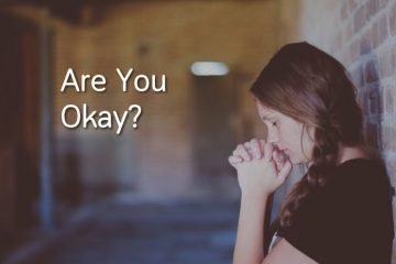 Women upset with text readnig "Are You Okay?"