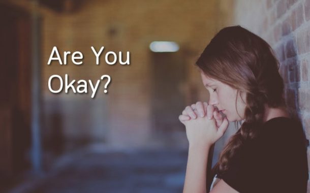 Women upset with text readnig "are you okay? "